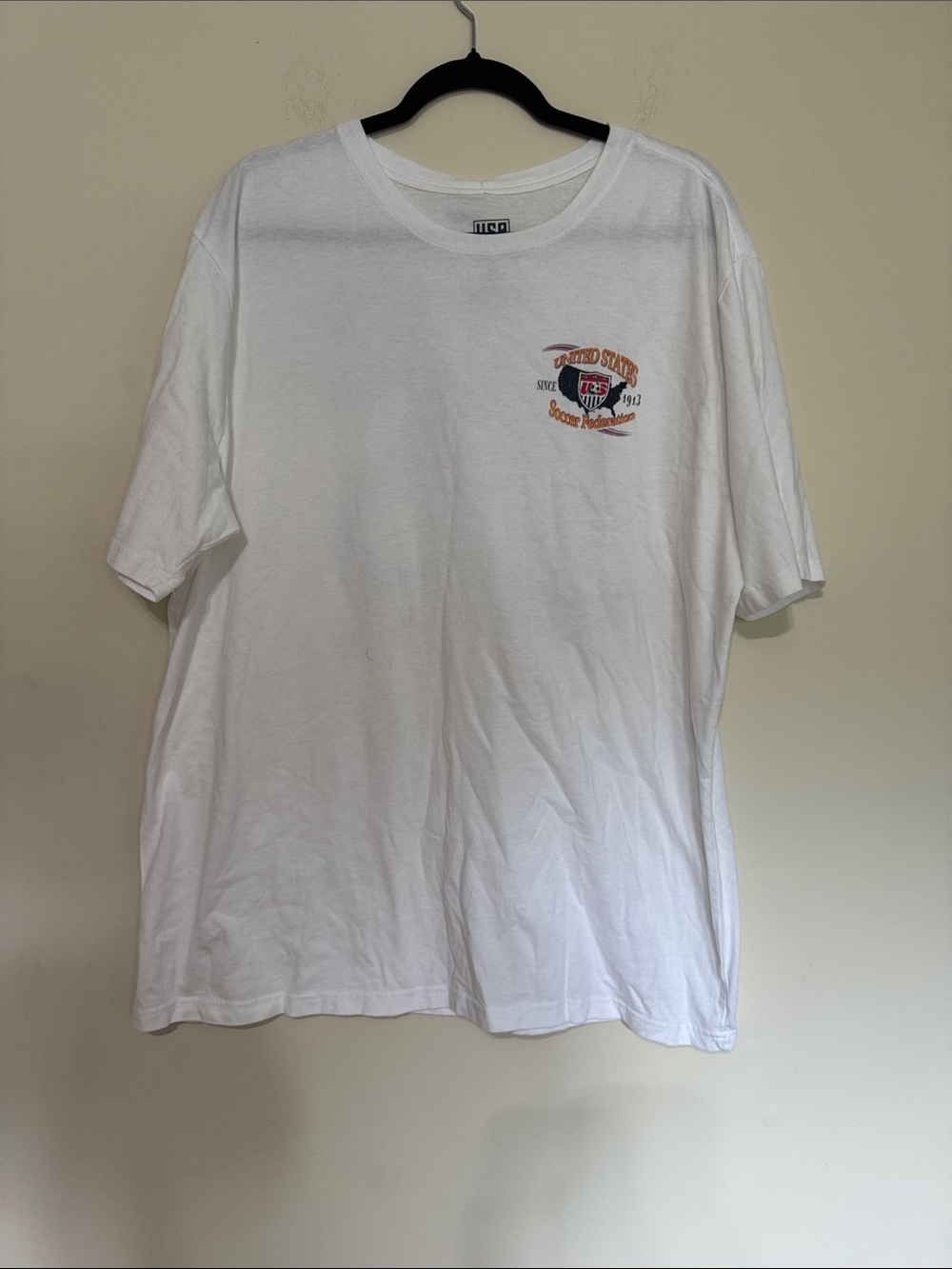 TC White Short Sleeve Tee with Orange and Blue Chest Graphic